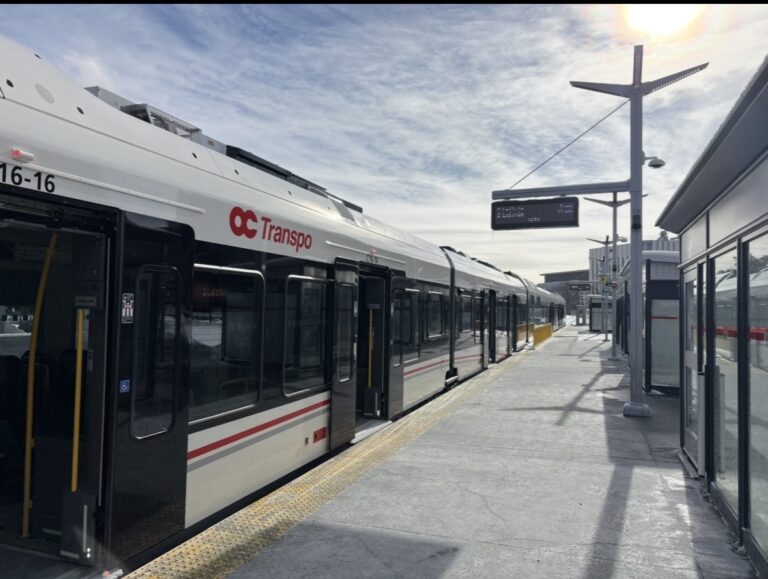 The LRT train stopping in Line 2's Carleton Station